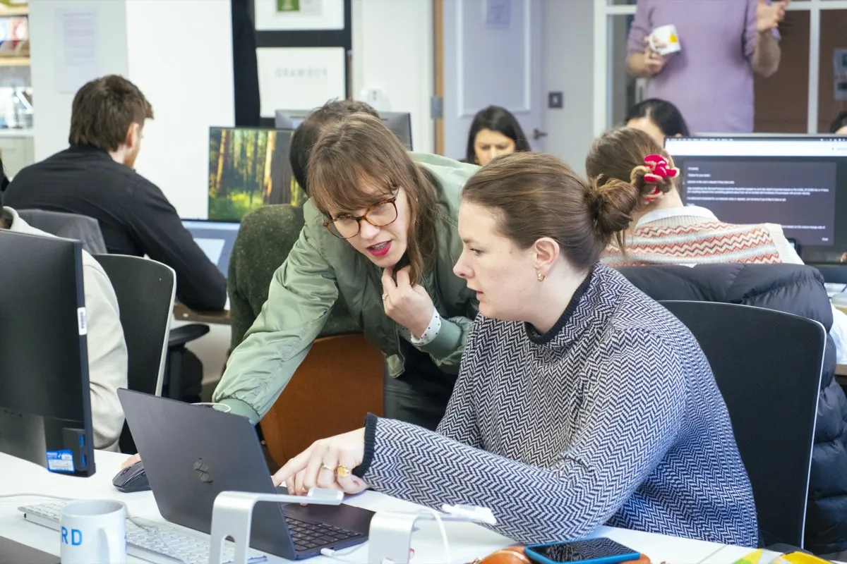 Instructor coaching a workshop participant